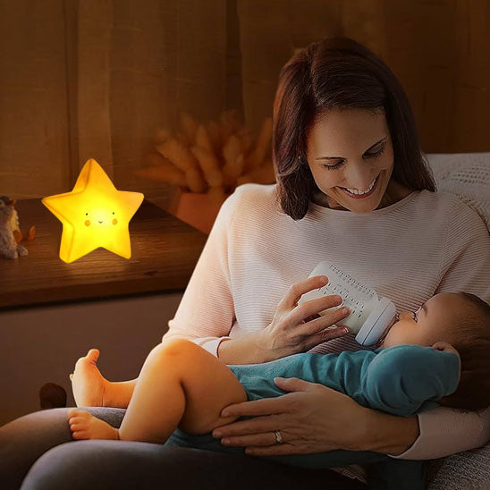 bébé boit son biberon veilleuse bébé